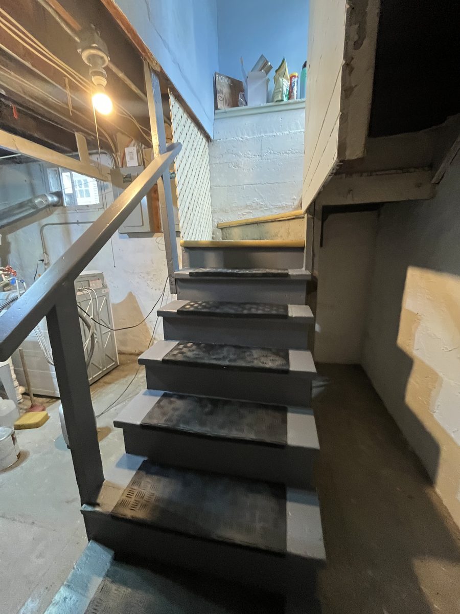 Basement stairs after restoration painted railing Saint Paul Minnesota - JAM Custom Carpentry