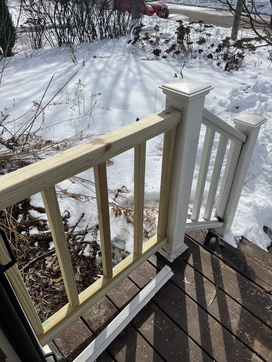 New deck railing section installed winter Saint Paul Minneapolis Minnesota - JAM Custom Carpentry