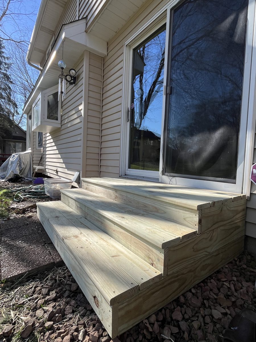 New green treated exterior entry steps installed Saint Paul Minneapolis - JAM Custom Carpentry