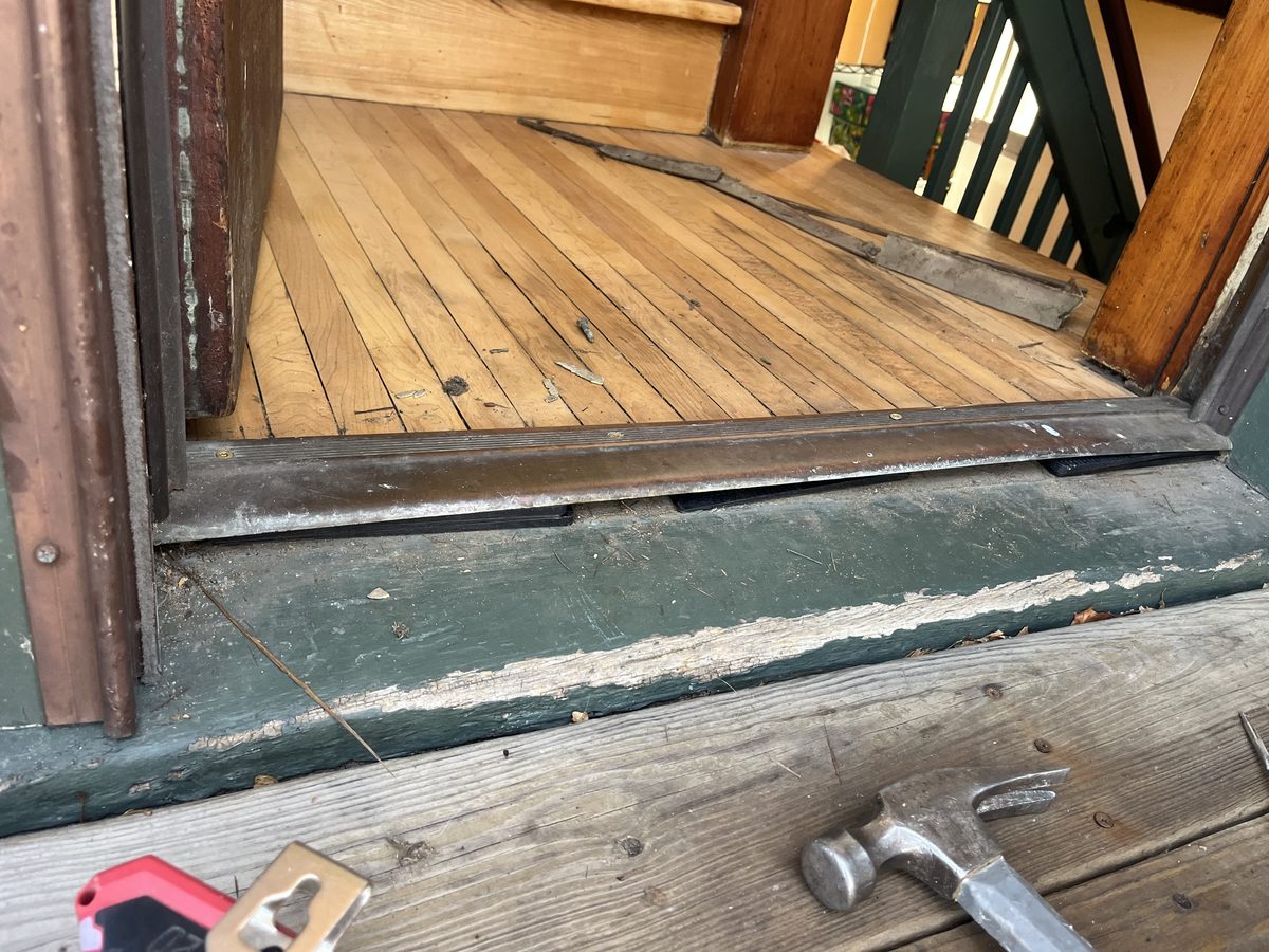 Rotted door threshold before repair historic Saint Paul home - JAM Custom Carpentry