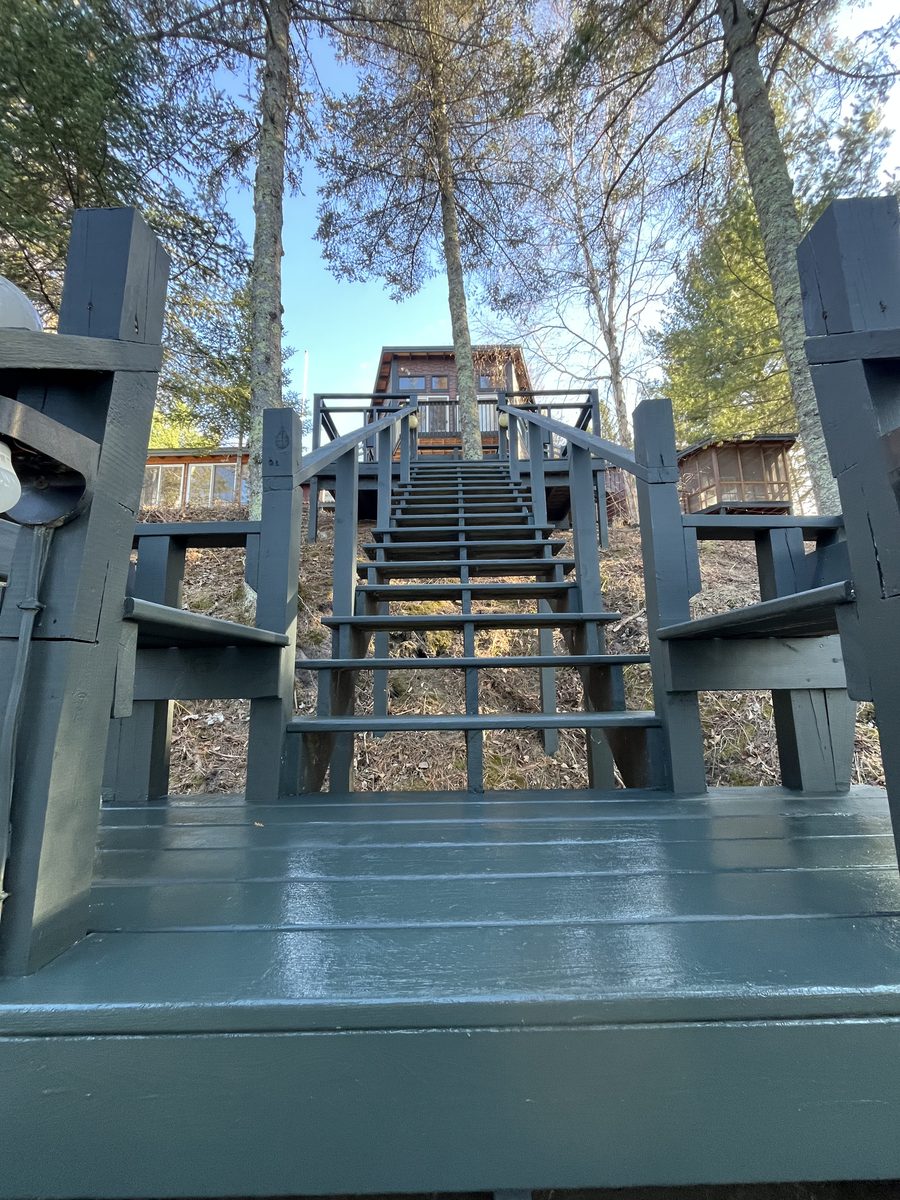Exterior painted staircase lake cabin Minnesota restoration - JAM Custom Carpentry