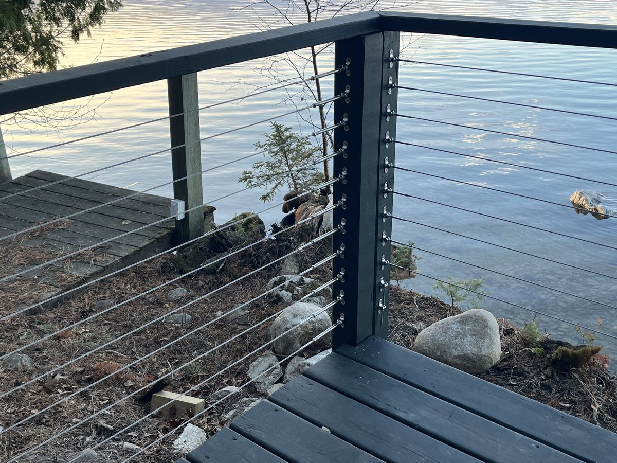 Cable railing post detail lakeside deck Minnesota lake cabin - JAM Custom Carpentry