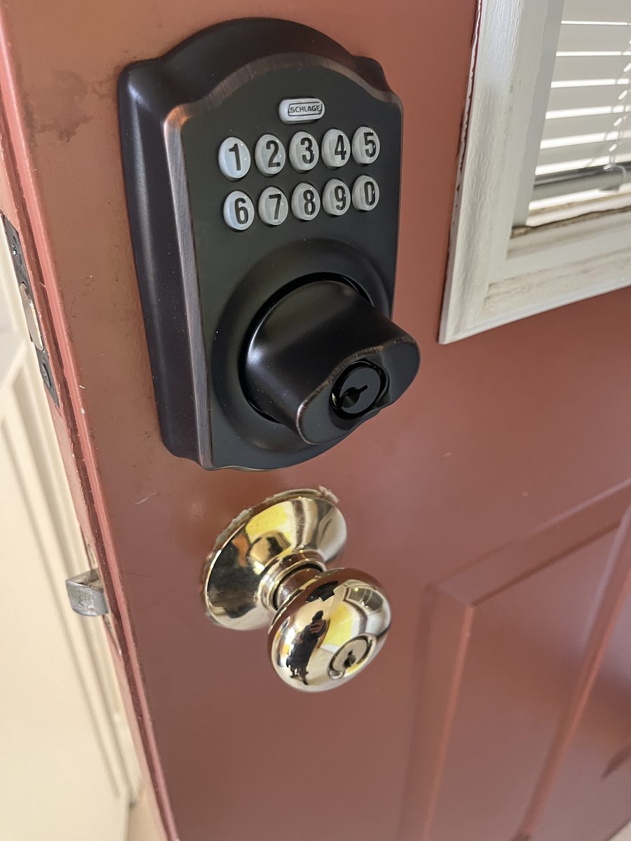 Schlage keypad deadbolt installation red door Saint Paul historic home - JAM Custom Carpentry