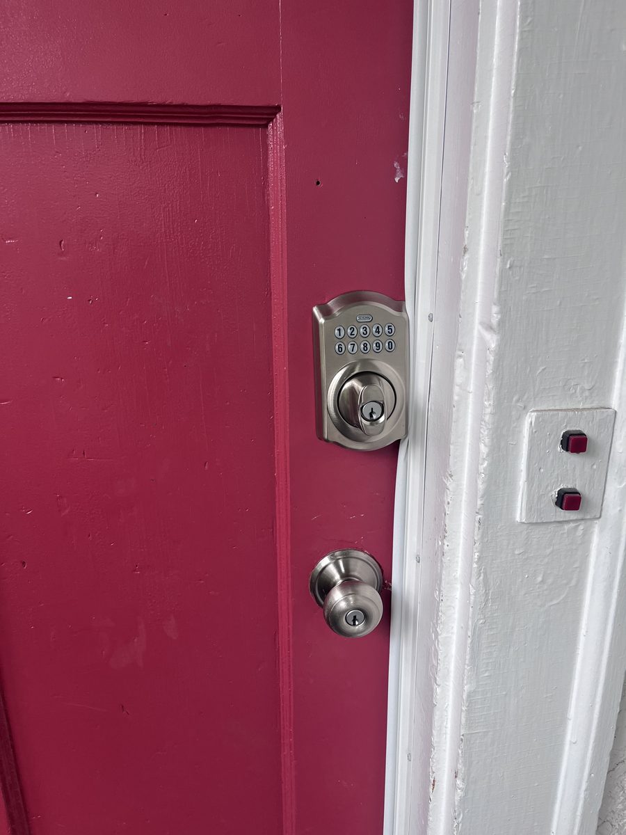 Smart lock keypad installation pink door Saint Paul Minneapolis Minnesota - JAM Custom Carpentry