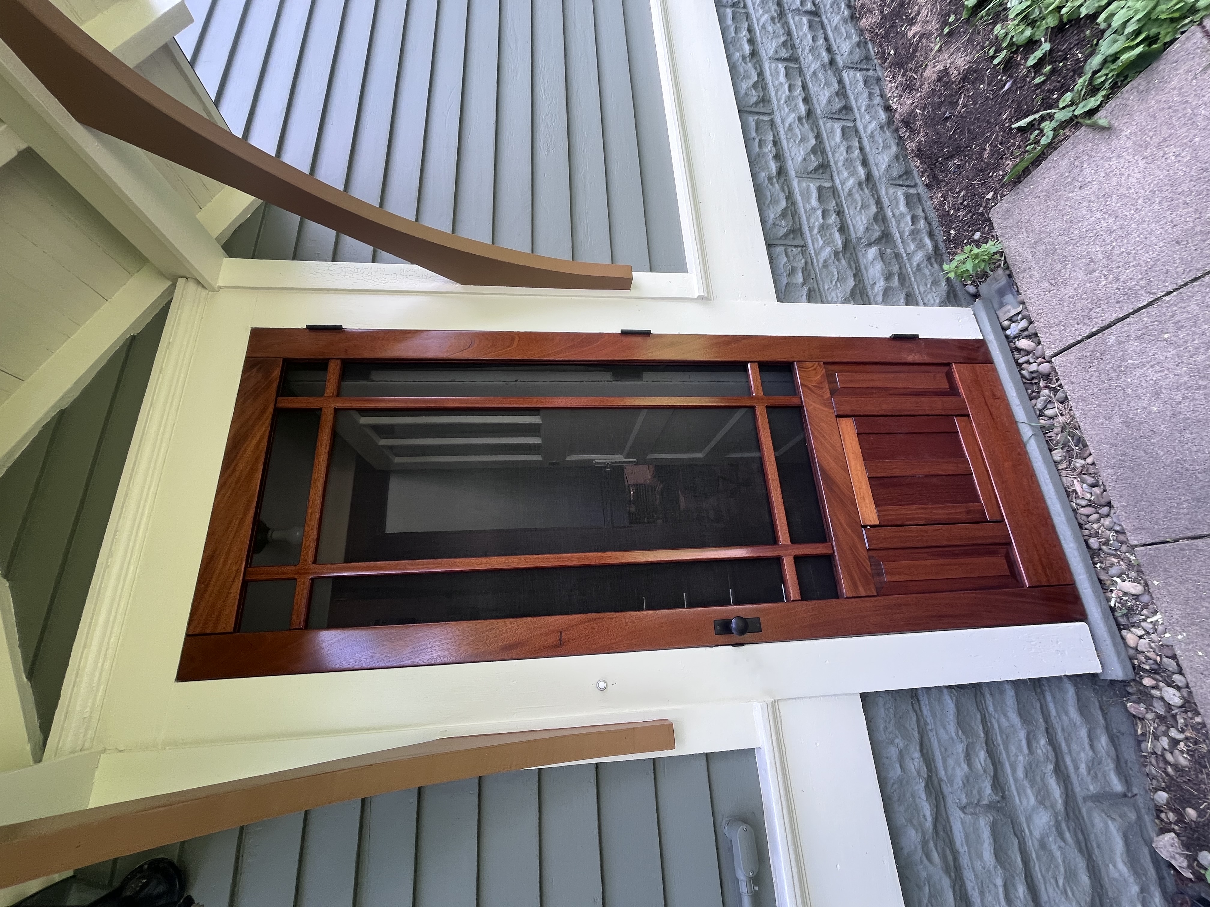 Mahogany storm door with built-in dog door, installed and fitted - Saint Paul Minnesota - JAM Custom Carpentry